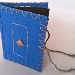 BlueBlack, (outside) 2016, 6.25 x 10 x 5", board, felt, paper, metal, hemp cord