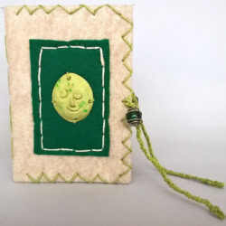 Green, (outside) 2016, 6.25 x 10 x 4.5", board, felt, paper, clay, paint, beads, metal, hemp cord