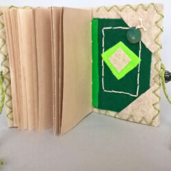 Green, (inside) 2016, 6.25 x 10 x 4.5", board, felt, paper, clay, paint, beads, metal, hemp cord